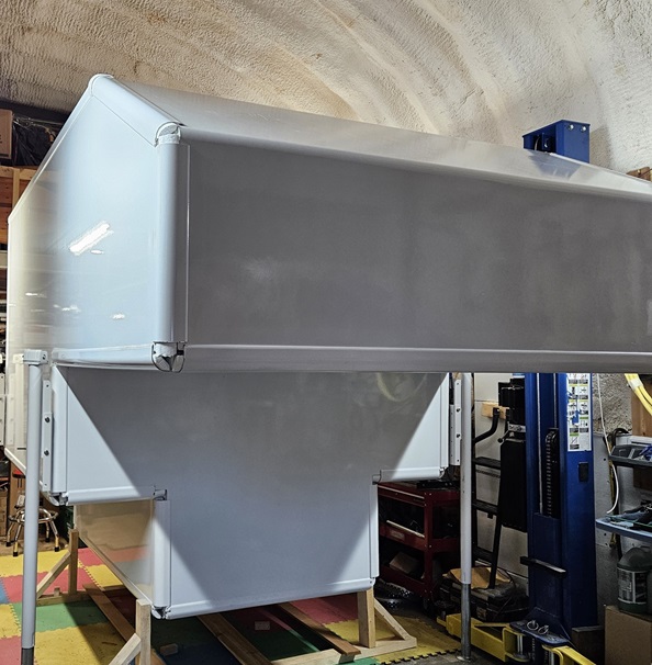 exterior view of composite camper in shop